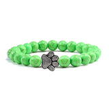 Margarida - Pulseira com estampa de patas decorada com miçangas.